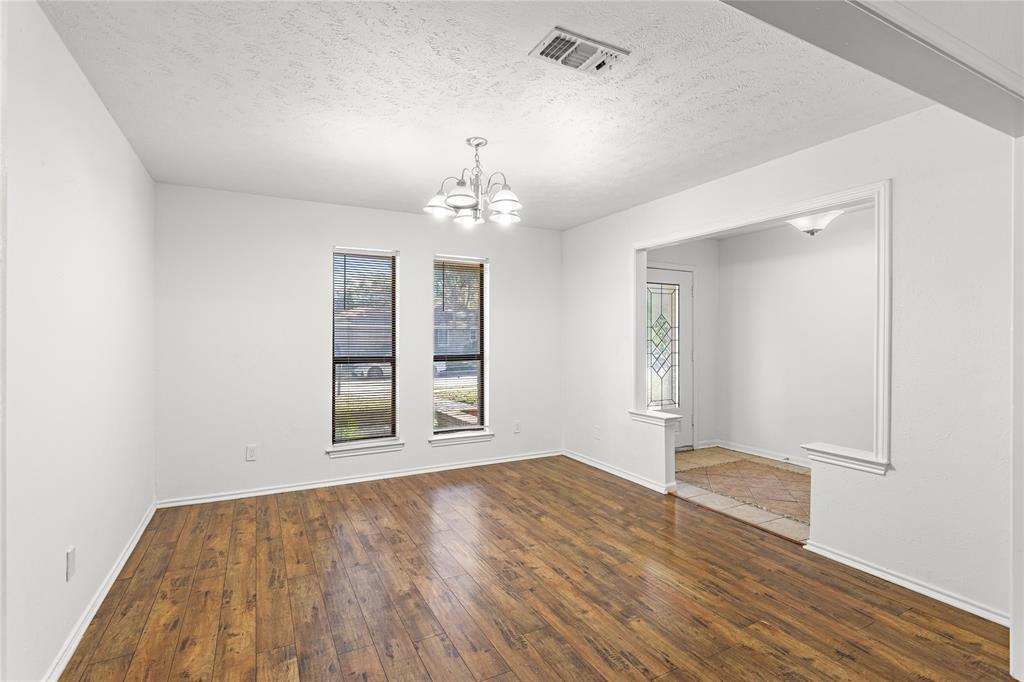 2421 Maple Leaf Drive Plano, TX 75075 - Photo 3 of 18 wooden floor in an empty room with a window