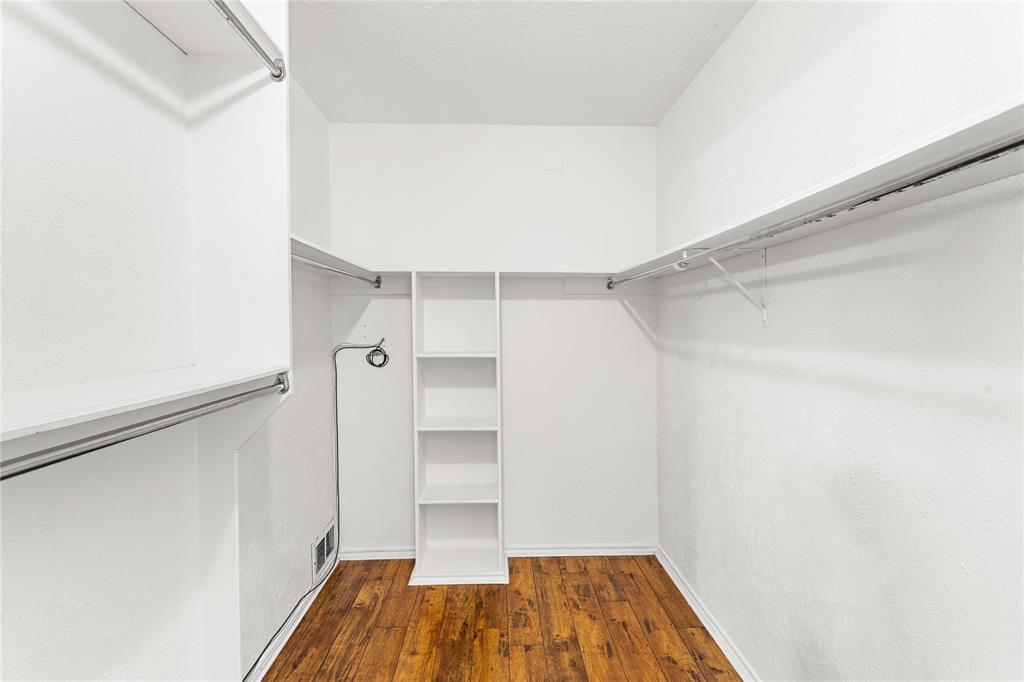 2421 Maple Leaf Drive Plano, TX 75075 - Photo 10 of 18 a view of a room with wooden floor and a window