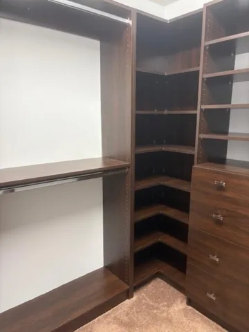 a room with gym equipment and a view of living room