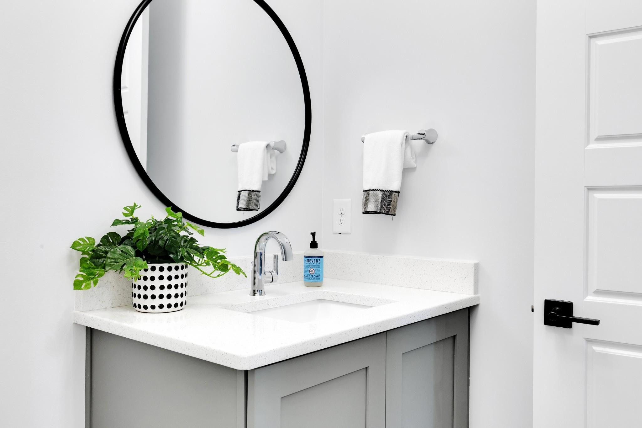 115 Crestview Road Raleigh, NC 27609 - Photo 31 of 42 Stylish Half Bath With White Lace Quartz Counter.