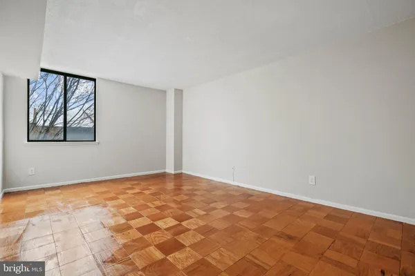 a view of an empty room with a window