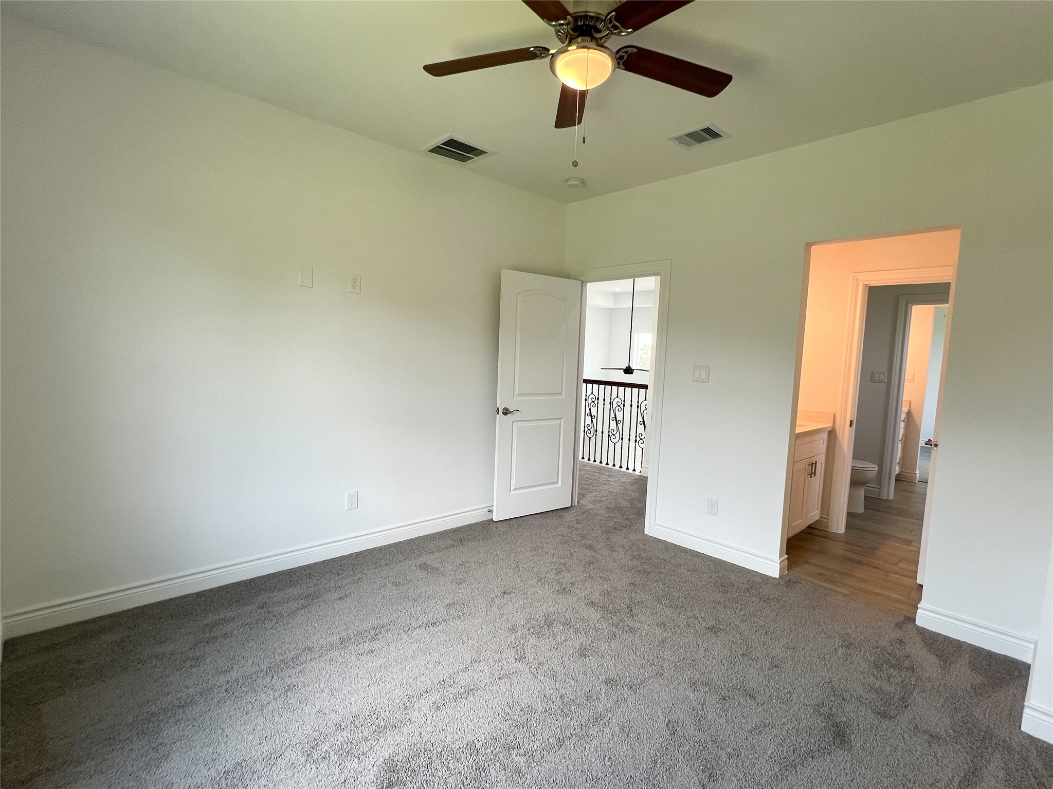 126 Lakeland Circle Rosharon, TX 77583 - Photo 36 of 49 wooden floor in an empty room and a ceiling fan