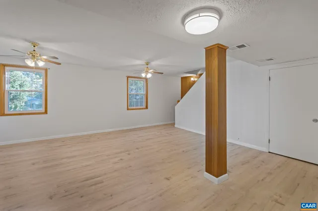 a bathroom with a sink mirror vanity and toilet