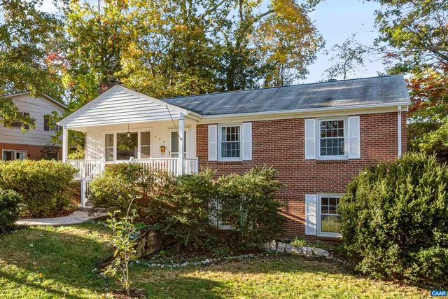 a front view of a house with a yard garage and outdoor seating