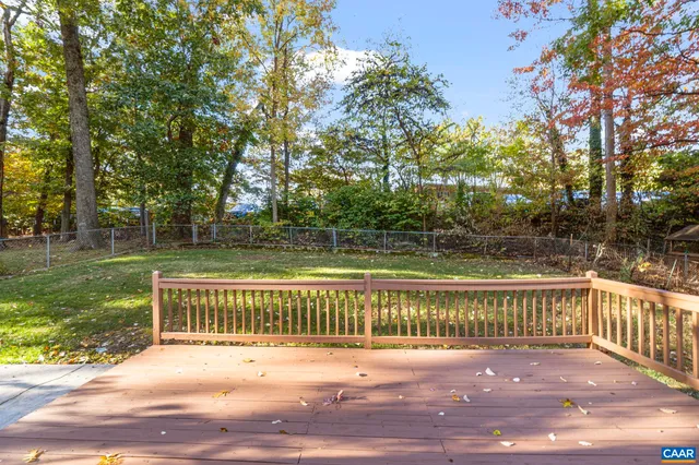 a view of a wooden deck with a trees