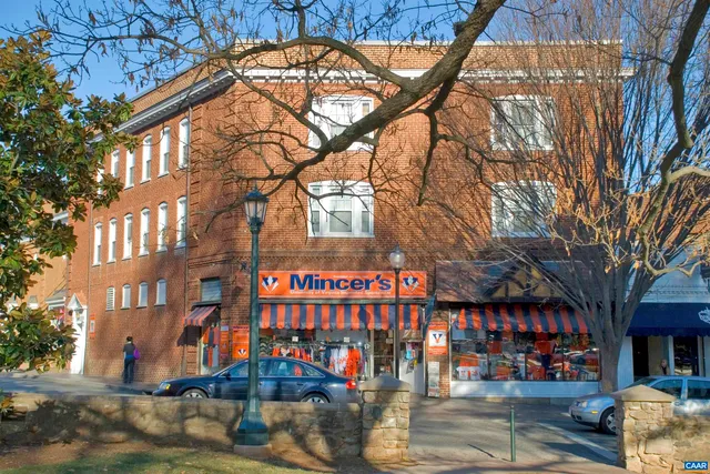 a city street lined with buildings and trees