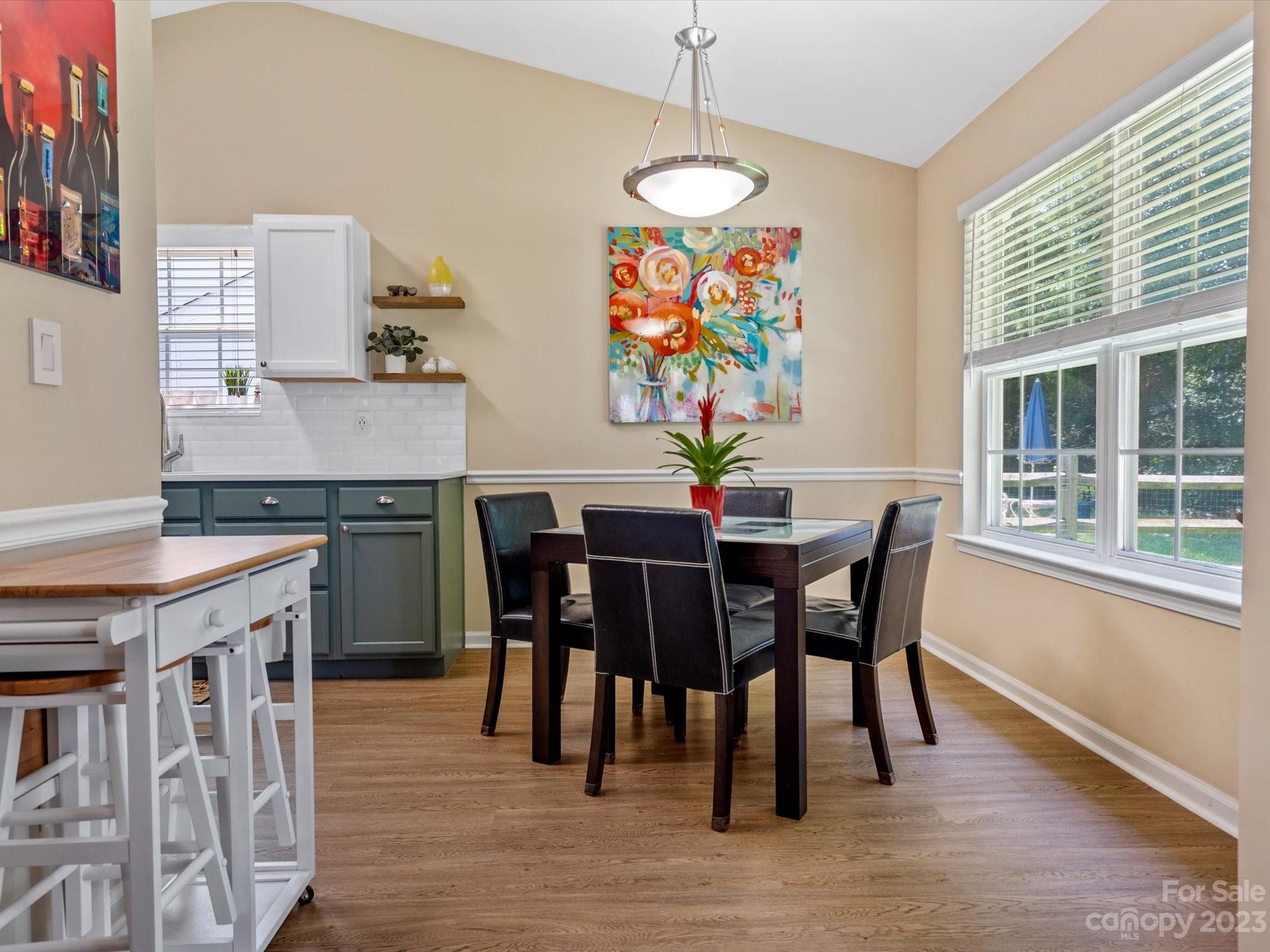 14510 Arbor Ridge Drive Charlotte, NC 28273 - Photo 13 of 34 a view of a dining room with furniture a rug and wooden floor
