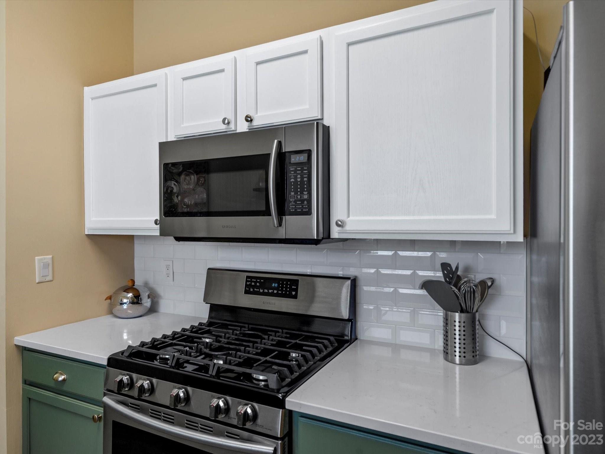 14510 Arbor Ridge Drive Charlotte, NC 28273 - Photo 18 of 34 a kitchen with stainless steel appliances a sink a stove and microwave