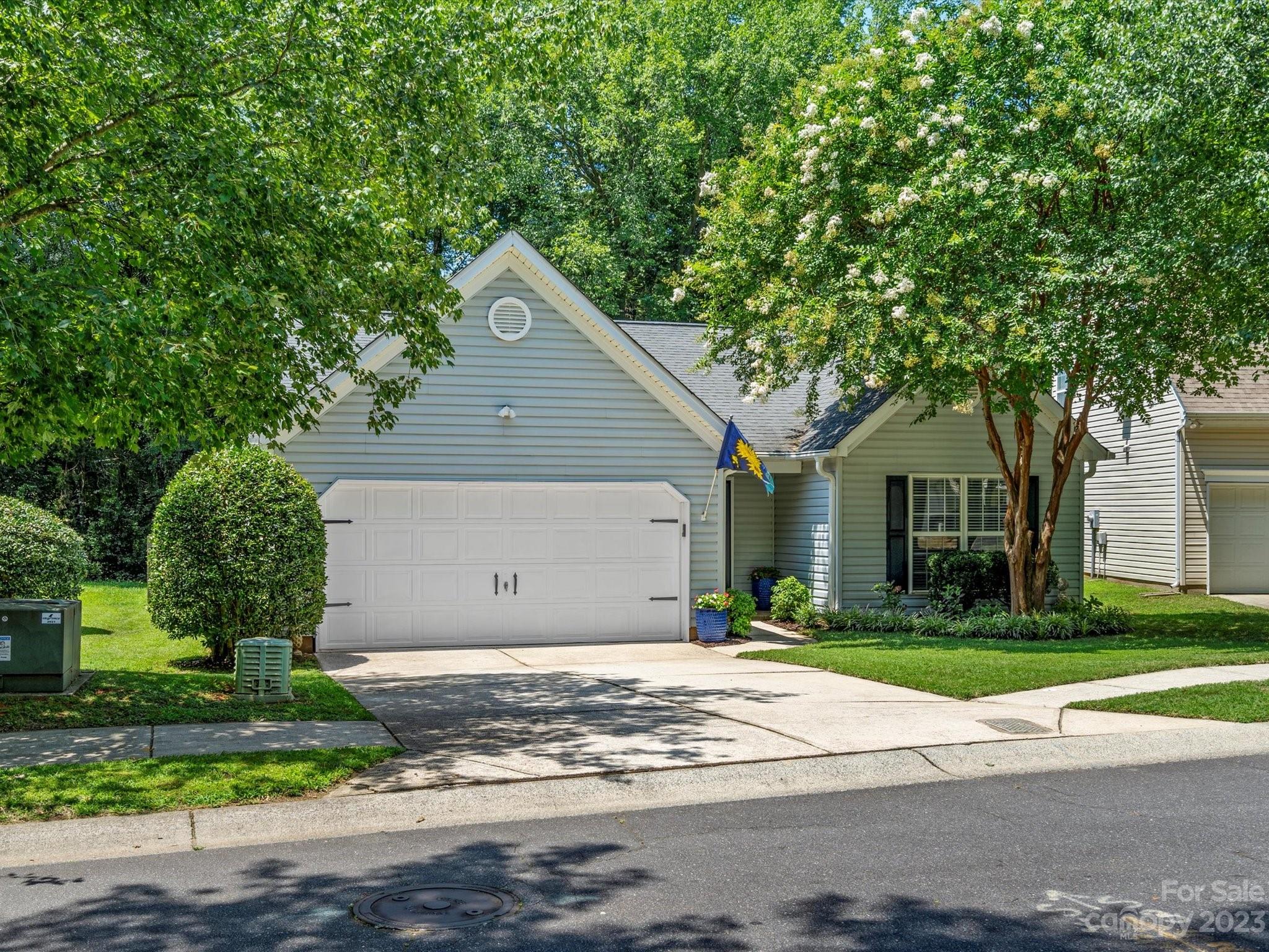 14510 Arbor Ridge Drive Charlotte, NC 28273 - Photo 2 of 34 a front view of a house with a yard and trees