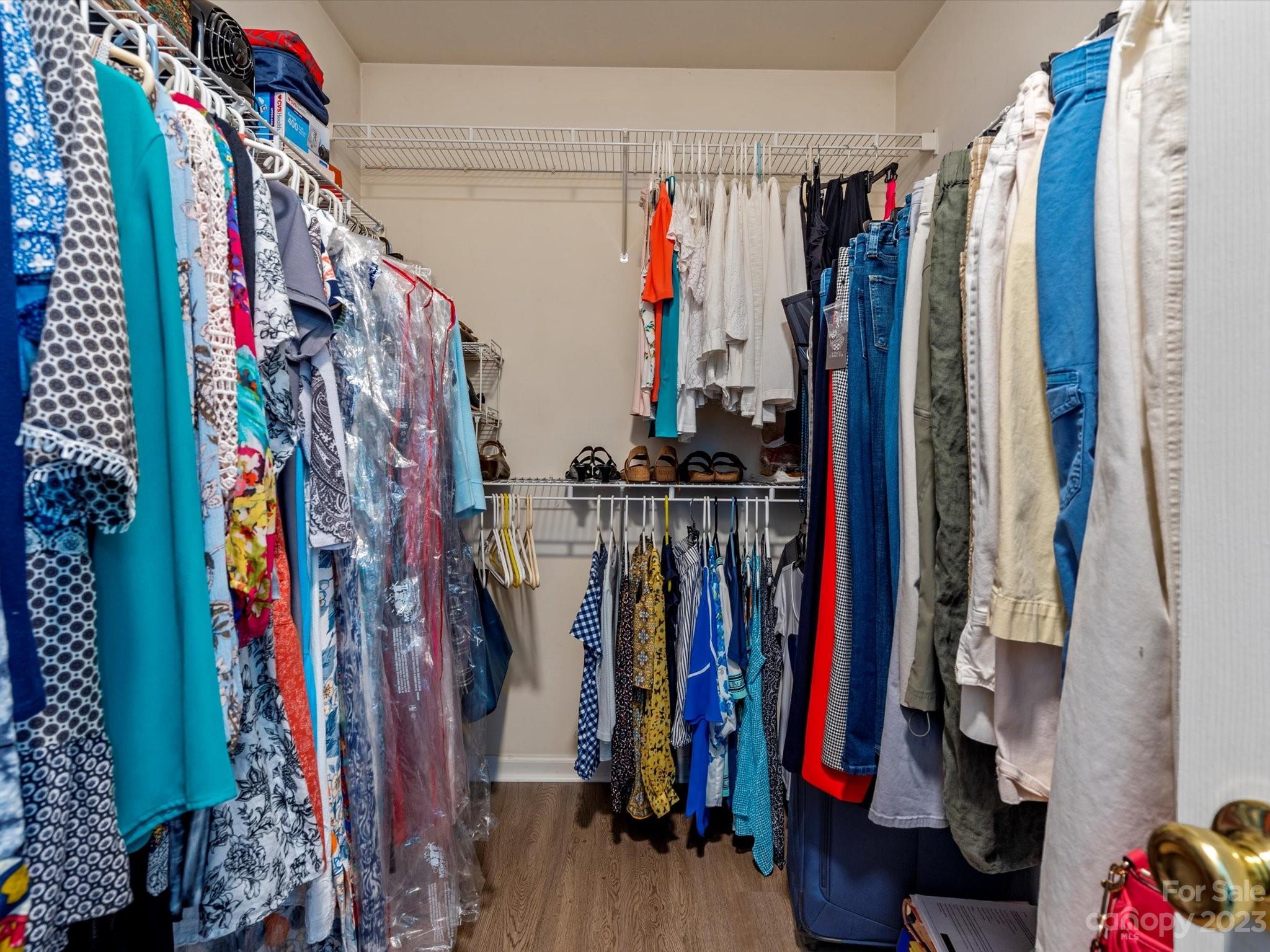 14510 Arbor Ridge Drive Charlotte, NC 28273 - Photo 21 of 34 a view of walk in closet with clothes