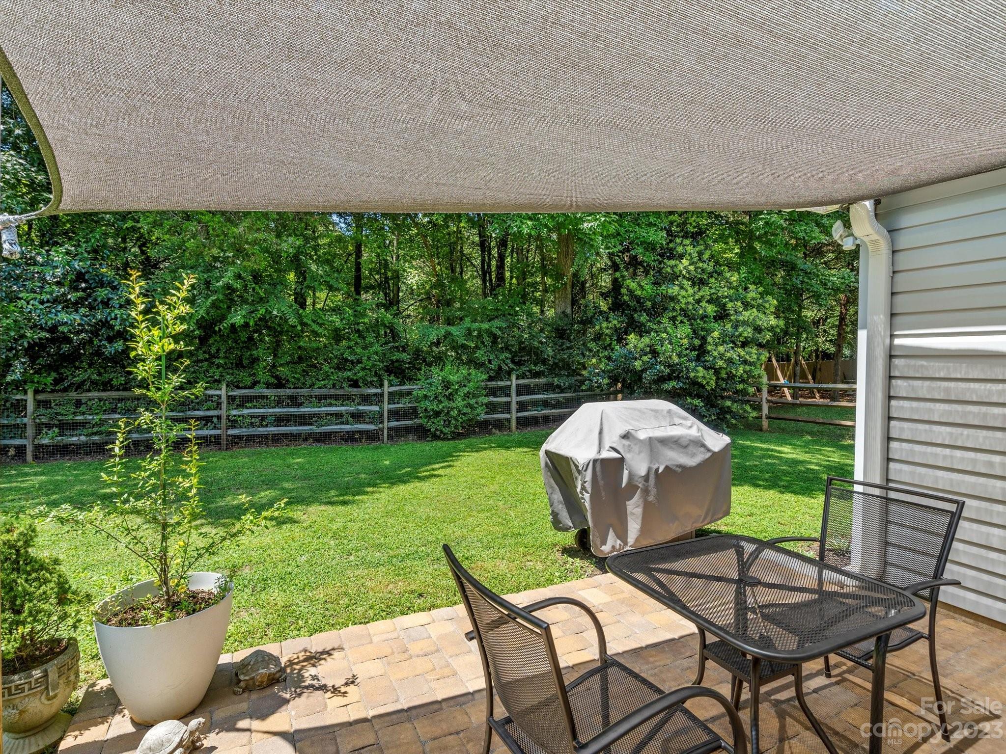 14510 Arbor Ridge Drive Charlotte, NC 28273 - Photo 27 of 34 a view of a chairs and table in the backyard