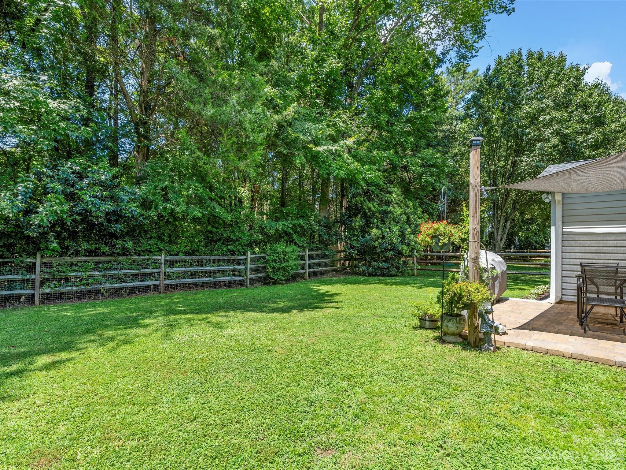 14510 Arbor Ridge Drive Charlotte, NC 28273 - Photo 28 of 34 a view of a table and chairs in the garden