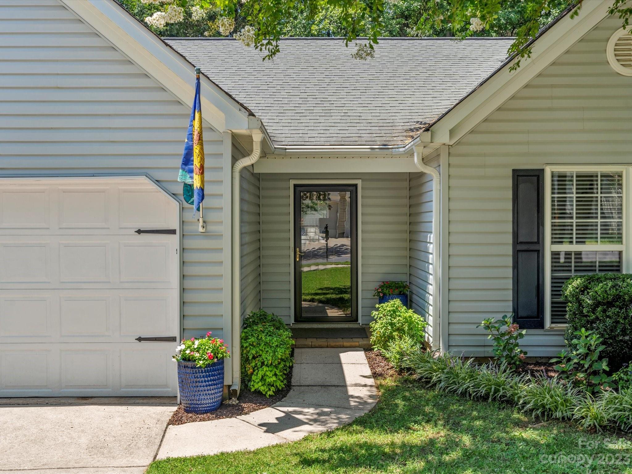 14510 Arbor Ridge Drive Charlotte, NC 28273 - Photo 4 of 34 a front view of a house with garden
