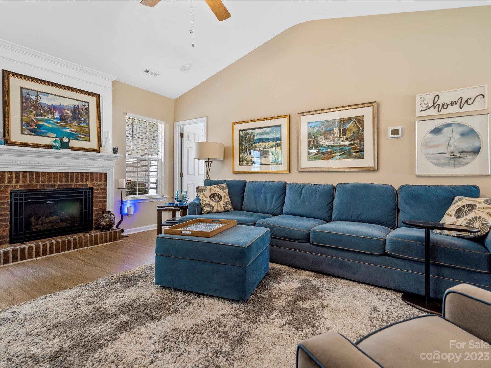 14510 Arbor Ridge Drive Charlotte, NC 28273 - Photo 8 of 34 a living room with furniture a rug and a fireplace