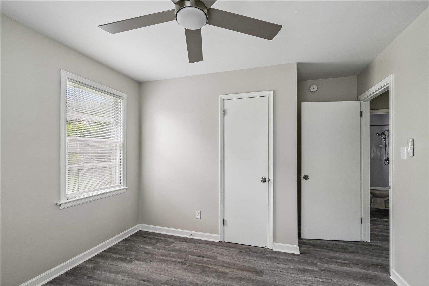 2518 Manchester Road Memphis, TN 38114 - Photo 14 of 23 Room featuring wood-finish flooring, a contemporary ceiling fan, and light gray wall tones