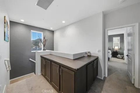 a kitchen with a stove and a refrigerator