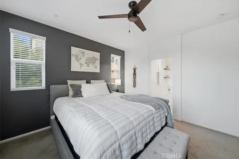 a bedroom with bed and window