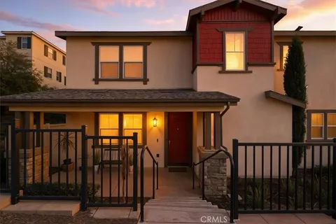 a view of front door and deck of a house