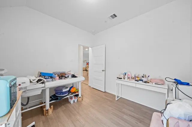 a bathroom with a sink vanity mirror and toilet