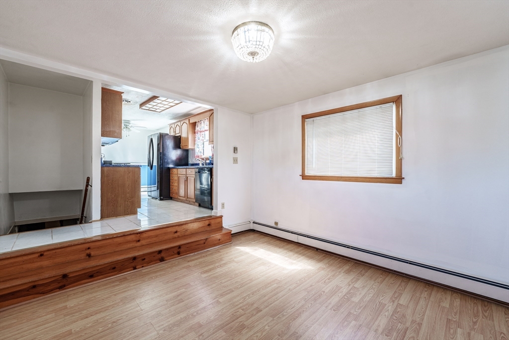 127 Cheyenne Road Springfield, MA 01109 - Photo 16 of 42 a view of room with wooden floor and window