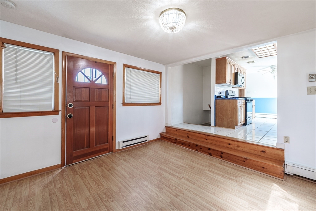 127 Cheyenne Road Springfield, MA 01109 - Photo 17 of 42 wooden floor in an empty room with a window