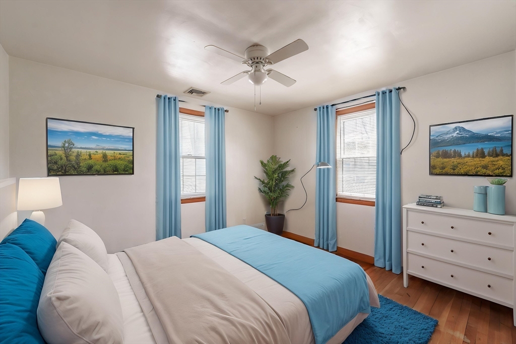 127 Cheyenne Road Springfield, MA 01109 - Photo 23 of 42 a bedroom with a large bed and a window
