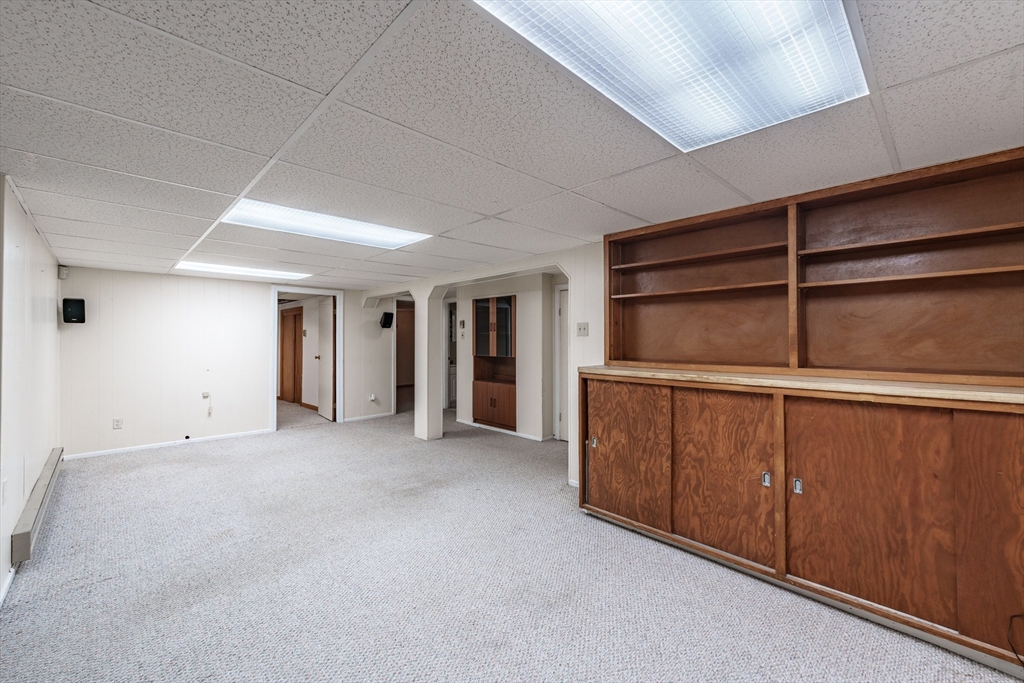 127 Cheyenne Road Springfield, MA 01109 - Photo 30 of 42 a view of an empty room with wooden shelves