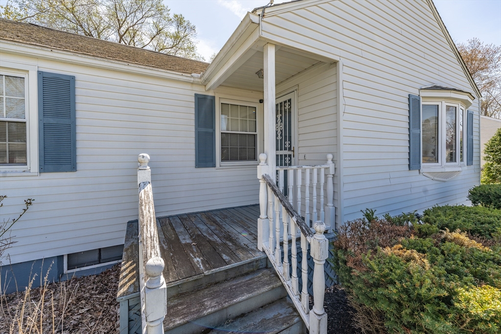 127 Cheyenne Road Springfield, MA 01109 - Photo 5 of 42 a view of a house with wooden fence