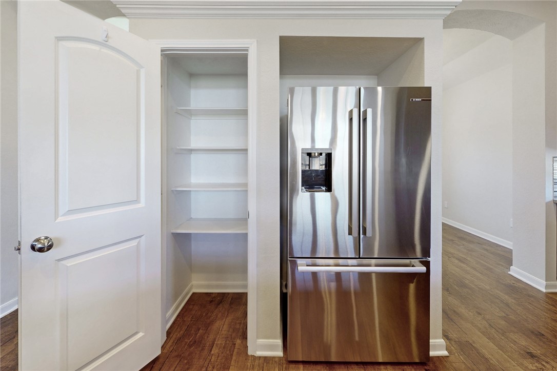 2101 Polmont Drive Bryan, TX 77807 - Photo 14 of 44 a view of walk in closet with wooden floor