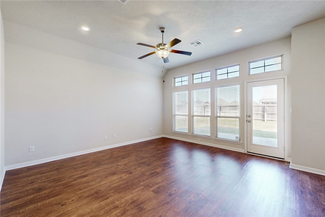 2101 Polmont Drive Bryan, TX 77807 - Photo 15 of 44 a view of an empty room with wooden floor and a window