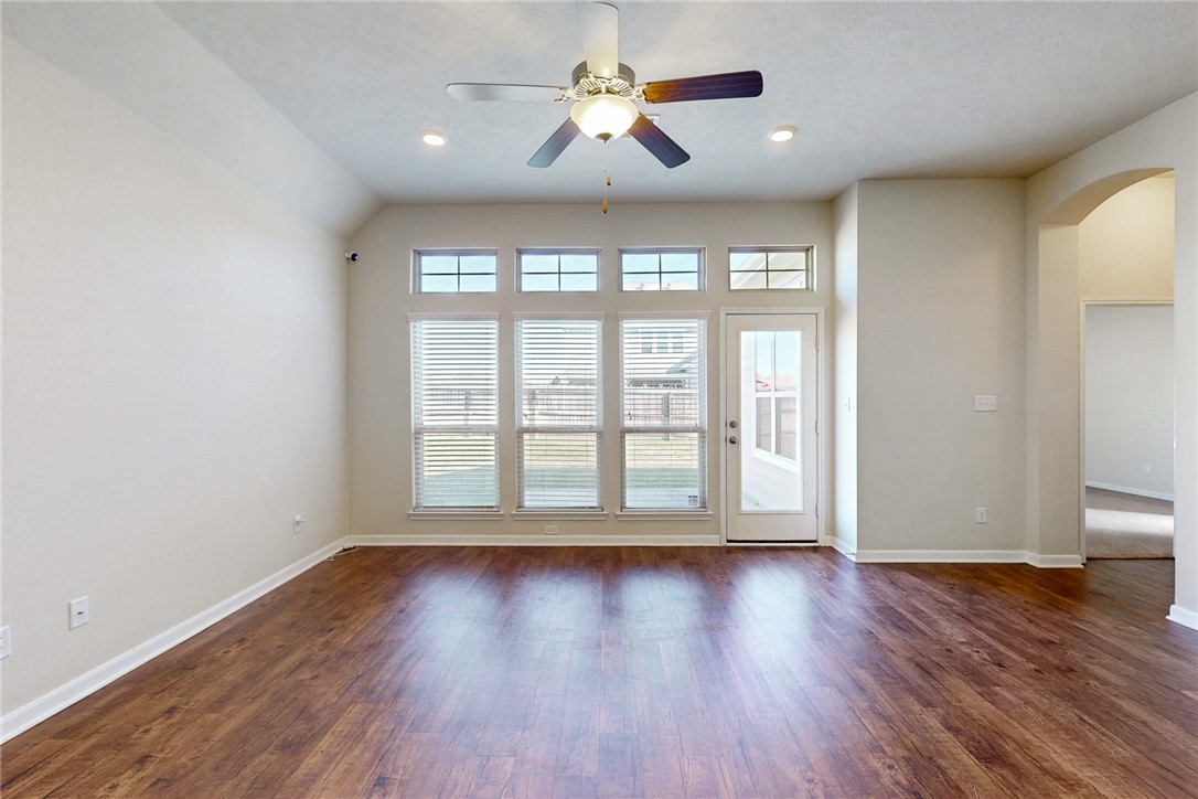 2101 Polmont Drive Bryan, TX 77807 - Photo 16 of 44 a view of empty room with wooden floor and fan