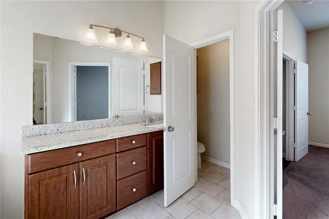 a white bath tub sitting next to a shower