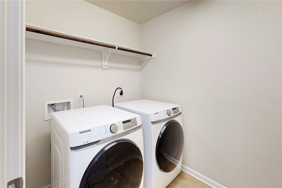 2101 Polmont Drive Bryan, TX 77807 - Photo 5 of 44 a utility room with dryer and washer