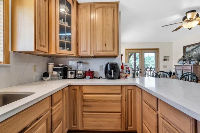 a view of a a dining room with furniture window and wooden floor