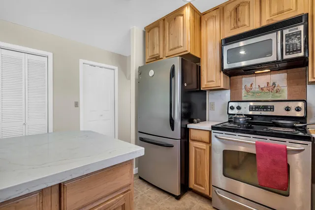 a view of walk in closet with clothes
