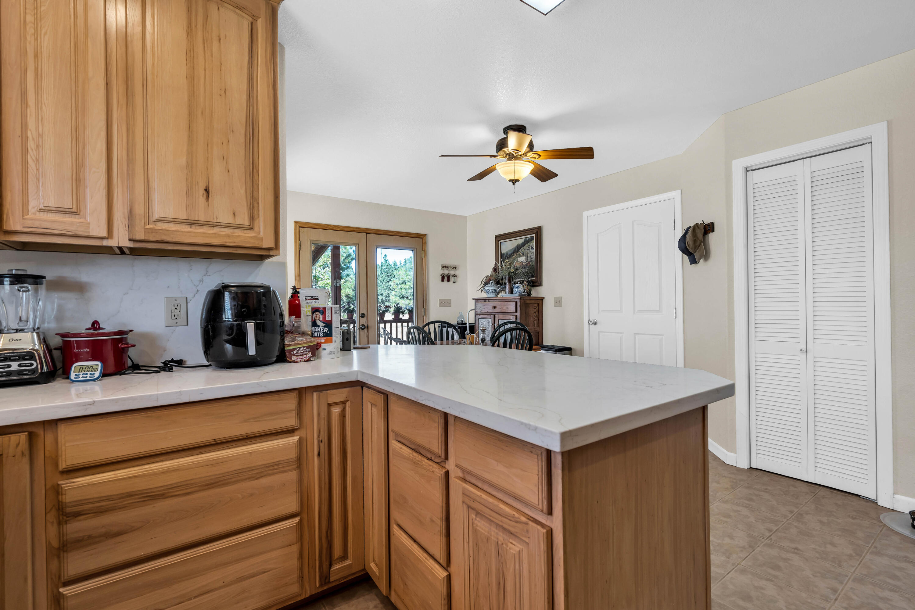 26929 Linfield Street Fall River Mills, CA 96028 - Photo 18 of 66 a kitchen with stainless steel appliances granite countertop a sink dishwasher and cabinets with wooden floor