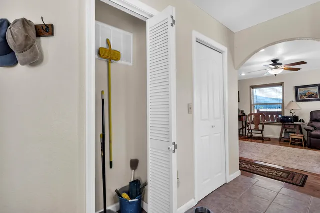 a spacious bathroom with a toilet sink and a mirror