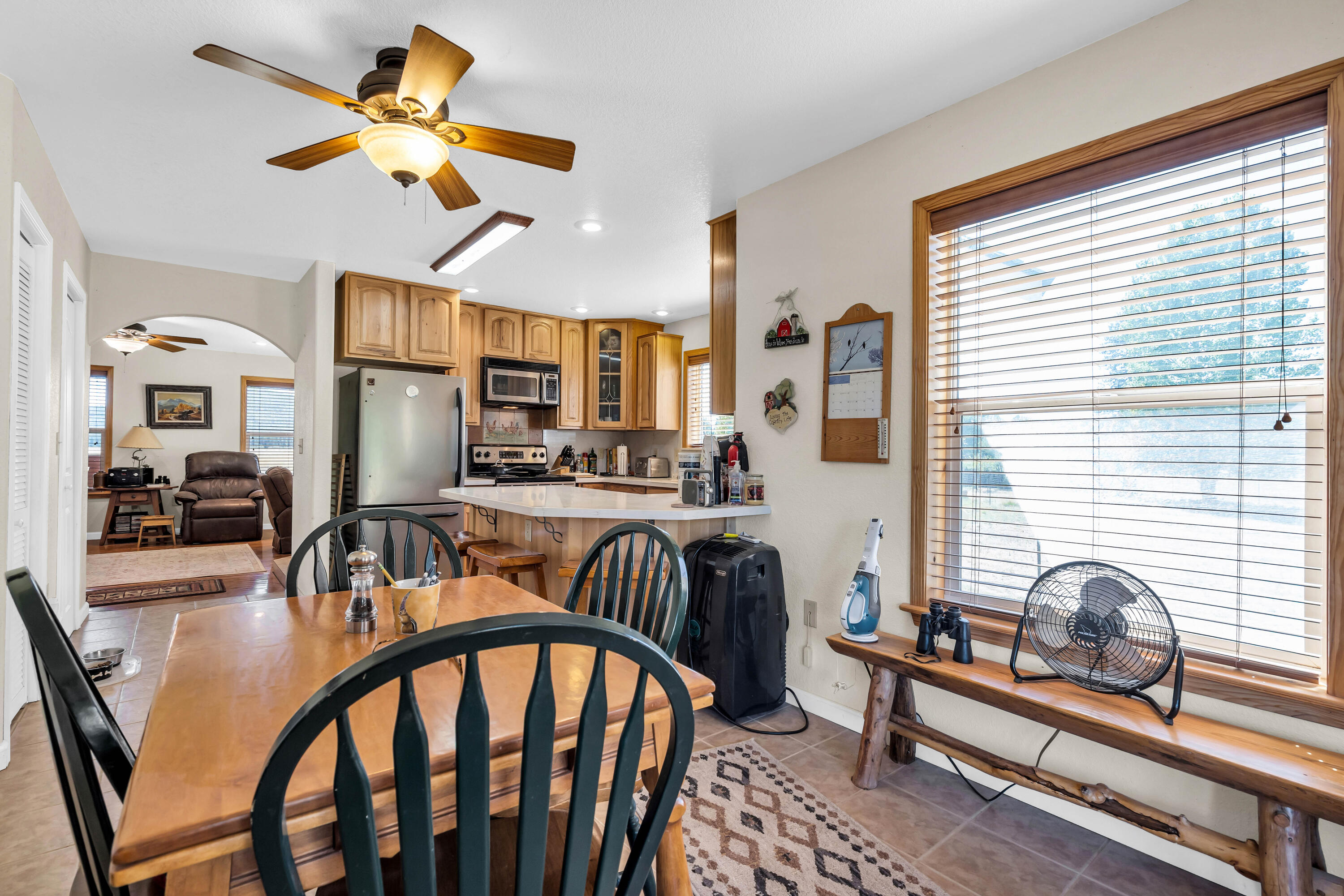 26929 Linfield Street Fall River Mills, CA 96028 - Photo 21 of 66 a dining room with furniture and window