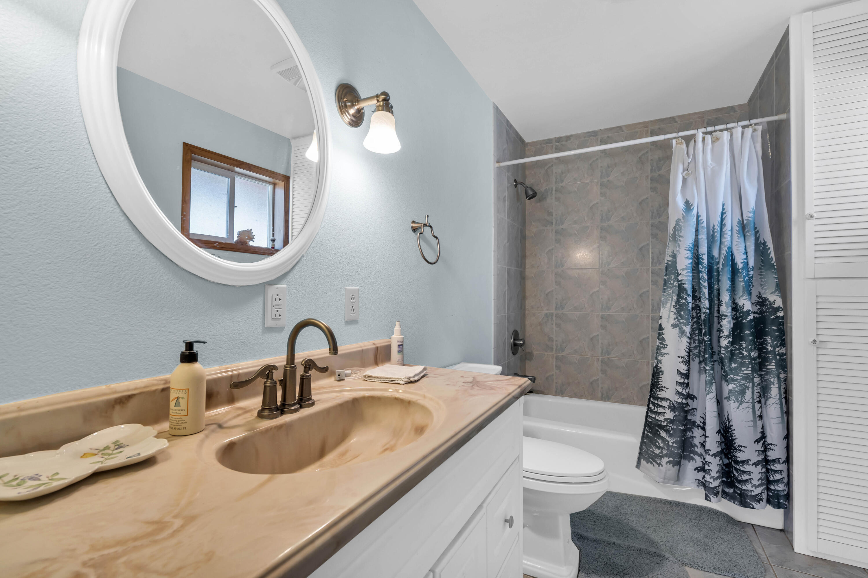 26929 Linfield Street Fall River Mills, CA 96028 - Photo 37 of 66 a bathroom with a granite countertop sink toilet and shower