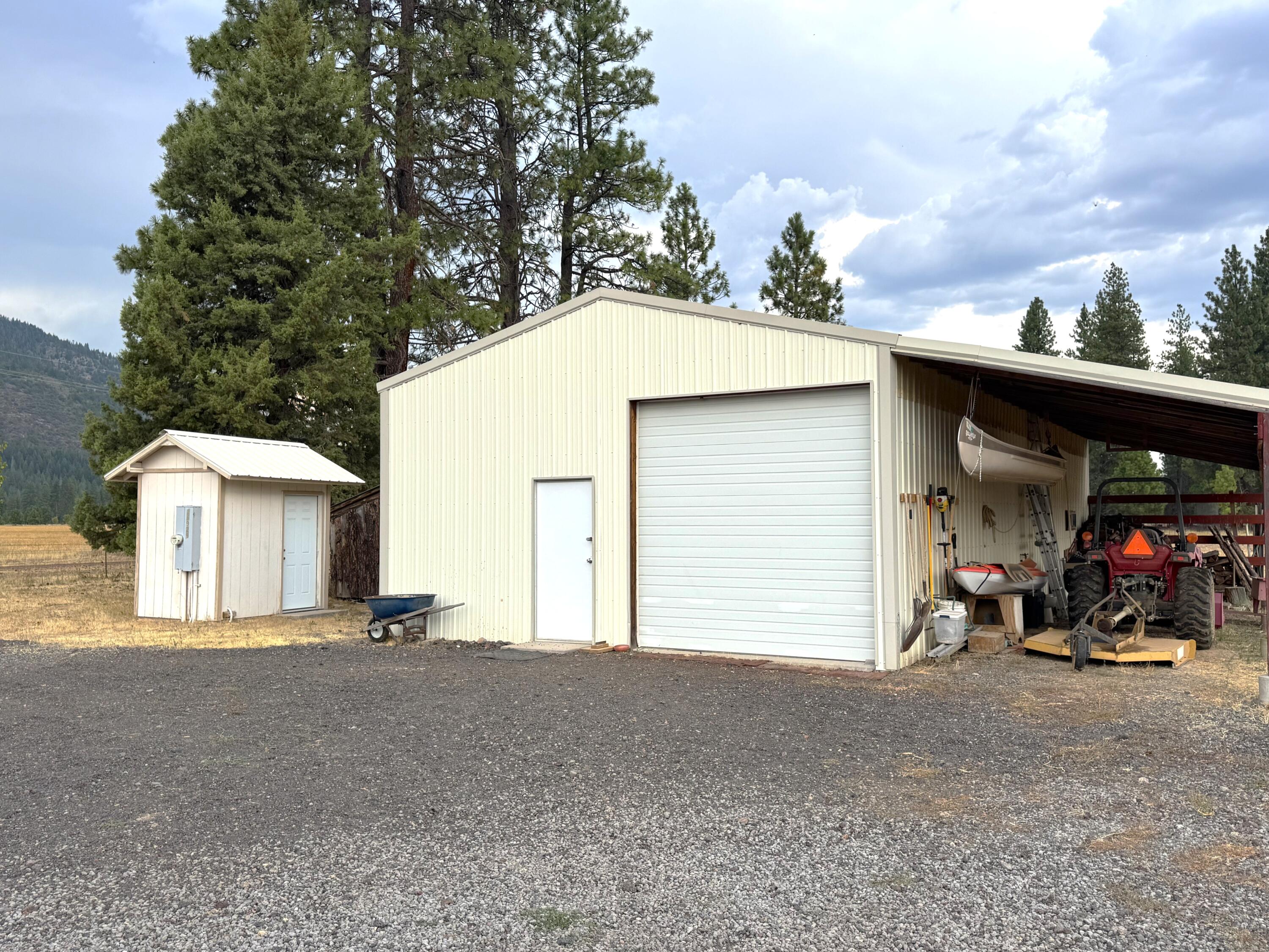 26929 Linfield Street Fall River Mills, CA 96028 - Photo 46 of 66 a view of a house with a outdoor space and porch