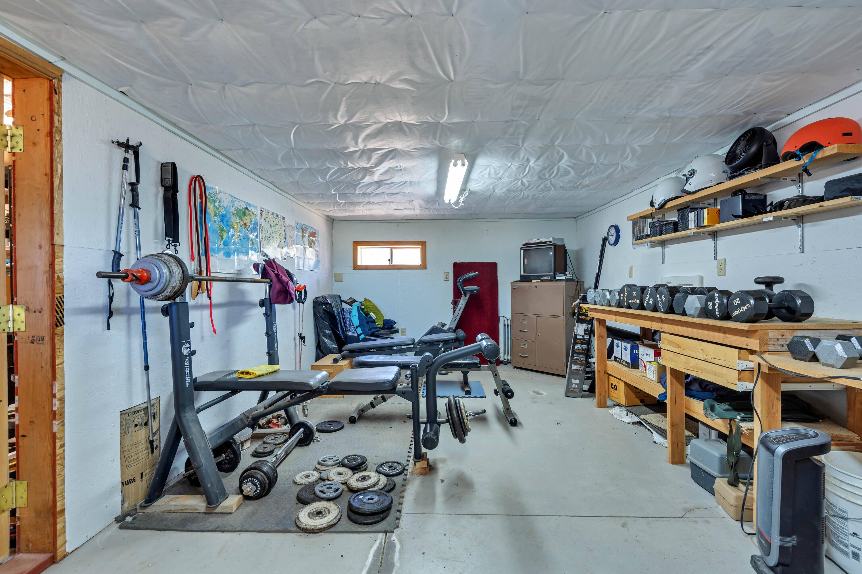 26929 Linfield Street Fall River Mills, CA 96028 - Photo 50 of 66 a bed room with furniture and a flat screen tv