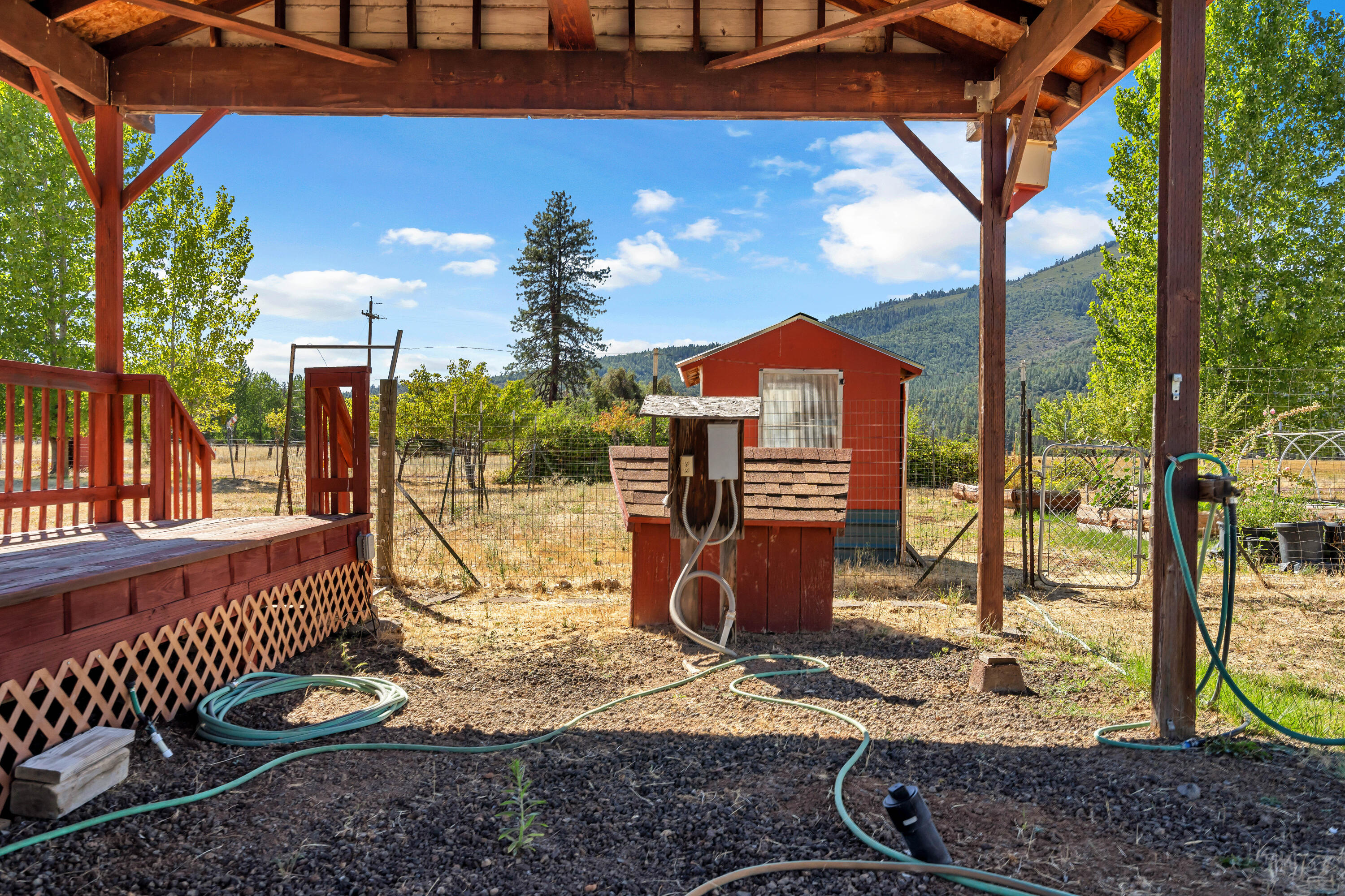 26929 Linfield Street Fall River Mills, CA 96028 - Photo 53 of 66 a view of a porch with a backyard