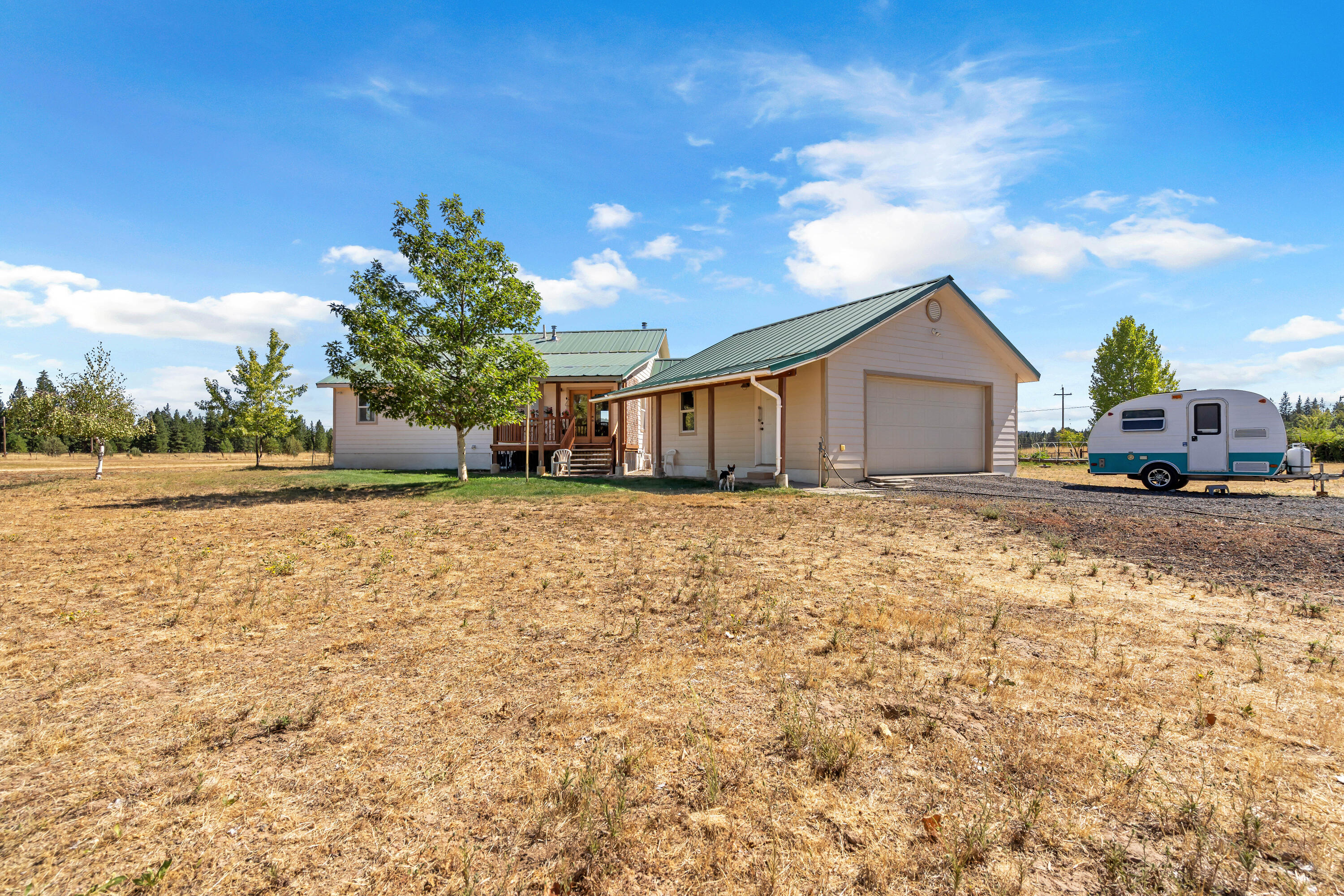 26929 Linfield Street Fall River Mills, CA 96028 - Photo 59 of 66 a view of a house with a yard