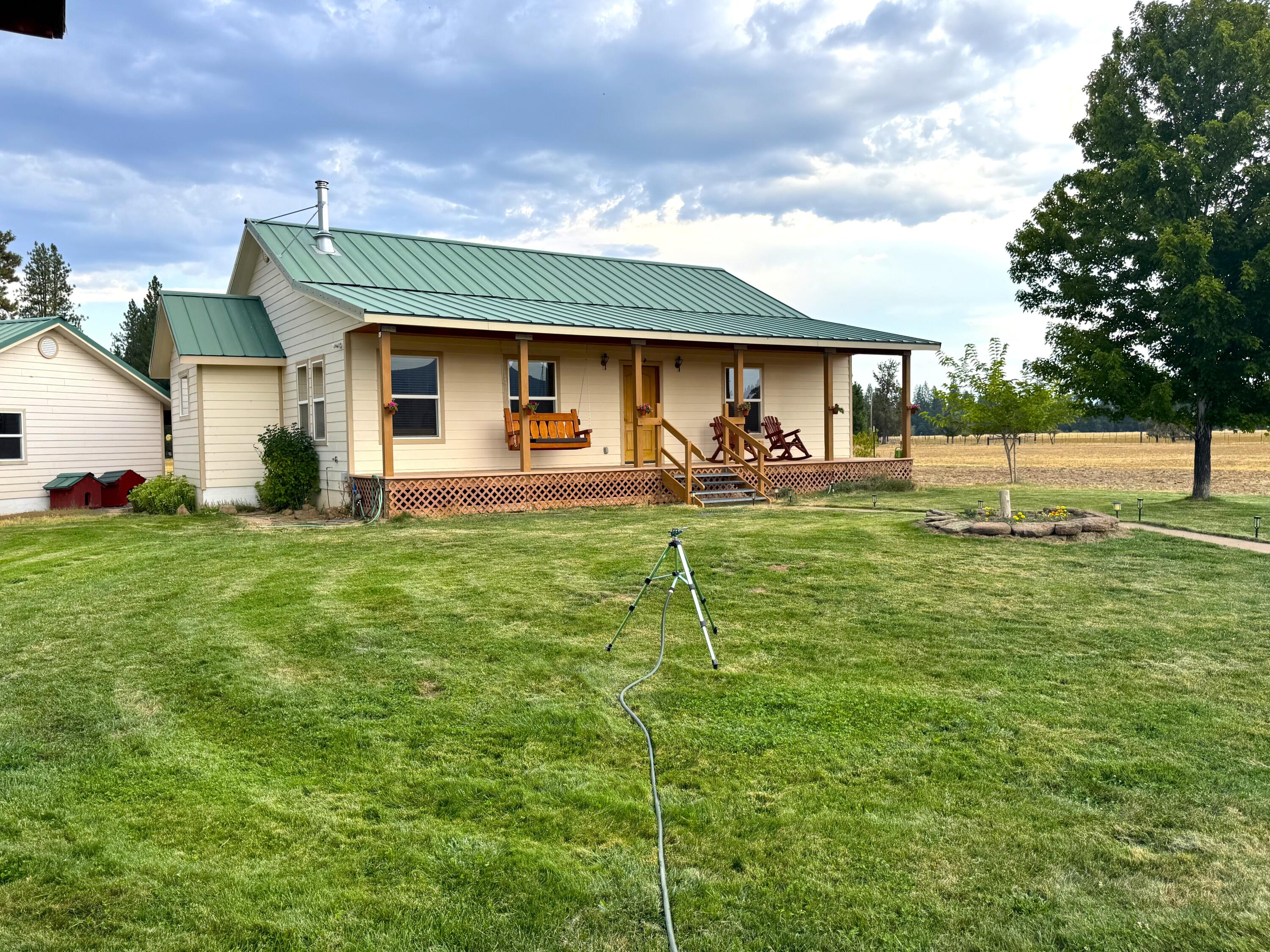 26929 Linfield Street Fall River Mills, CA 96028 - Photo 6 of 66 a backyard of a house with table and chairs
