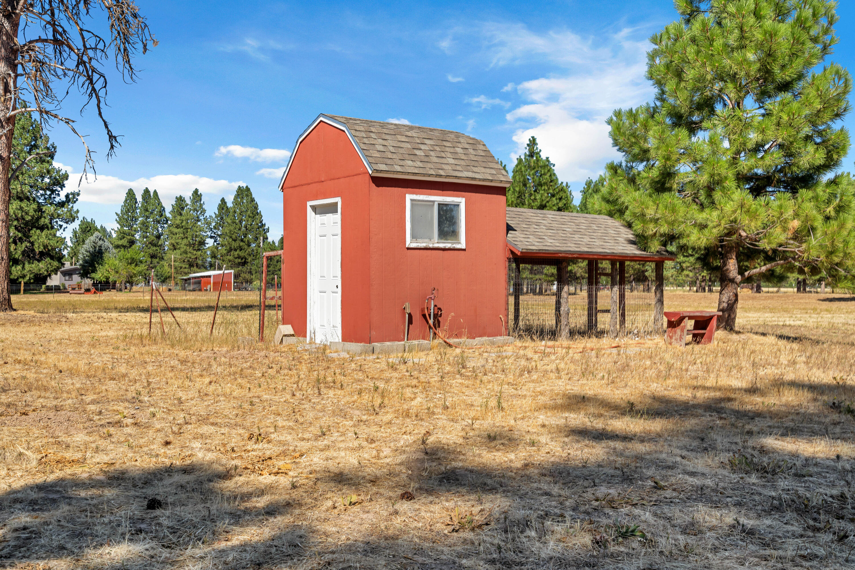 26929 Linfield Street Fall River Mills, CA 96028 - Photo 62 of 66 a front view of a house with a yard