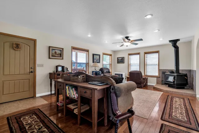 a kitchen with stainless steel appliances granite countertop a sink a stove and a refrigerator