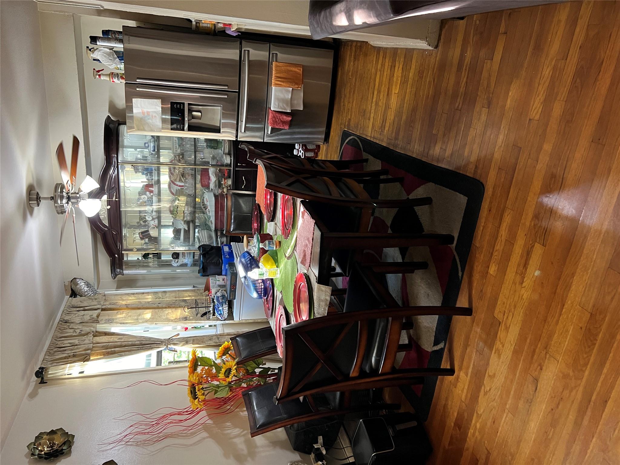 55-30 99th Street, Unit 2H Queens, NY 11368 - Photo 6 of 19 a view of a dining room with furniture window and wooden floor