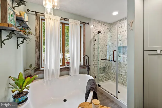 a kitchen with stainless steel appliances granite countertop a sink and a wooden floor