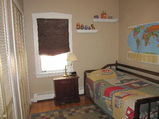 336 Olmsted Road Riverside, IL 60546 - Photo 11 of 12 a bedroom with a bed and a window