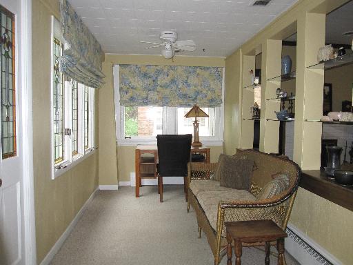 336 Olmsted Road Riverside, IL 60546 - Photo 2 of 12 a living room with furniture and a chandelier